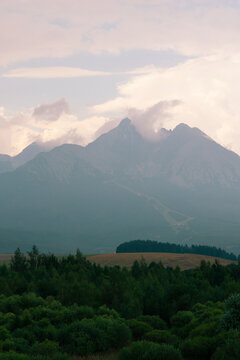 high tatras mountain range peaks including lomnicky stit, gerlachovsky stit in slovakia landscape view rocky summits cloudy sky concept of travel, tourism, nature