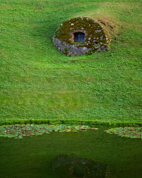 Mossy stone structure of the historic bunker creates a hidden shelter