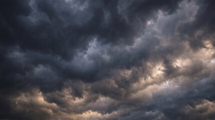 Fototapeta premium Ominous dark storm clouds cover the entire sky, creating a dramatic and foreboding natural backdrop.