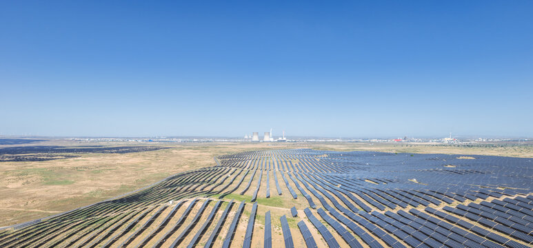 Aerial View of Vast Desert Solar Farm with Energy and Chemical Industry Base