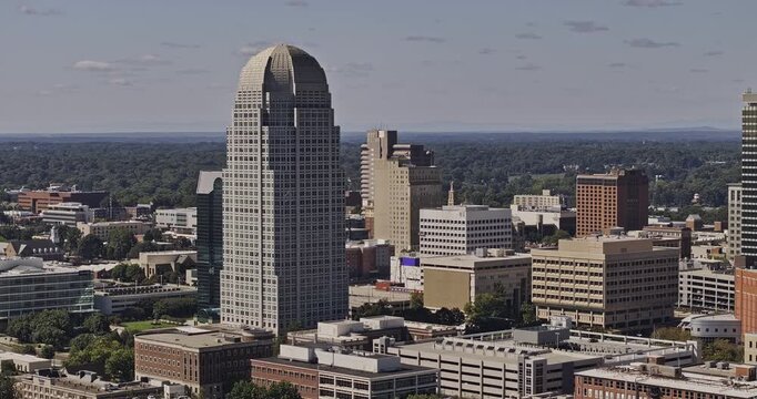 Winston-Salem North Carolina Aerial v16 telephoto low flyover circling downtown towers and surrounding city blocks - Shot with Mavic 3 Pro Cine - Oct 1st 2023