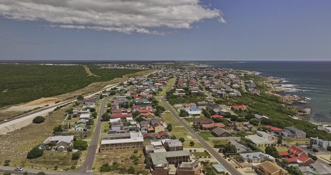 Gansbaai South Africa Aerial v26 low flyover above De Kelders residential townscape along a rugged coastal shoreline - Shot with Mavic 3 Pro Cine - Jan 8th 2024