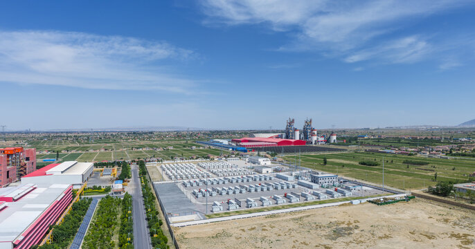 Aerial View of Energy Storage Power Station beside Industrial Factory Zone