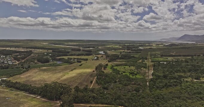 Stanford South Africa Aerial v2 rising flyover above farmland, Klein River and residential townscape across the coastal plain - Shot with Mavic 3 Pro Cine - Jan 9th 2024