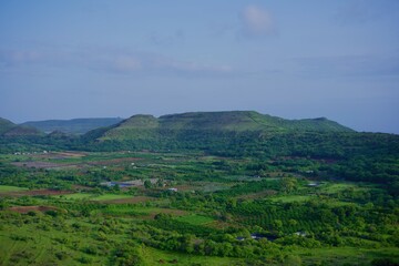 Fototapeta premium Lush green monsoon landscape in Maharashtra, India