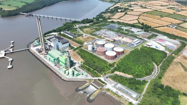 Drone panorama of electricity generation plant on the River Suir, Wexford, Ireland. power production with sweeping views of water, woodland and surrounding farmland.epic locations Ireland