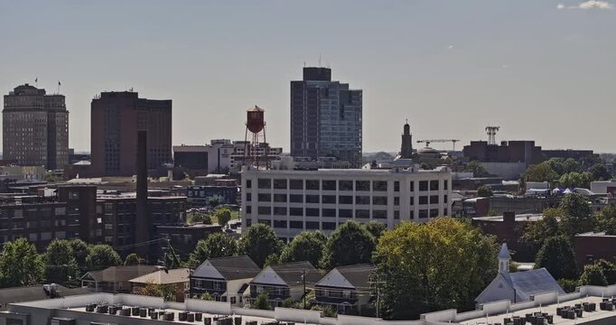 Winston-Salem North Carolina Aerial v22 telephoto low flyover from Northside toward downtown towers and the city skyline - Shot with Mavic 3 Pro Cine - Oct 1st 2023