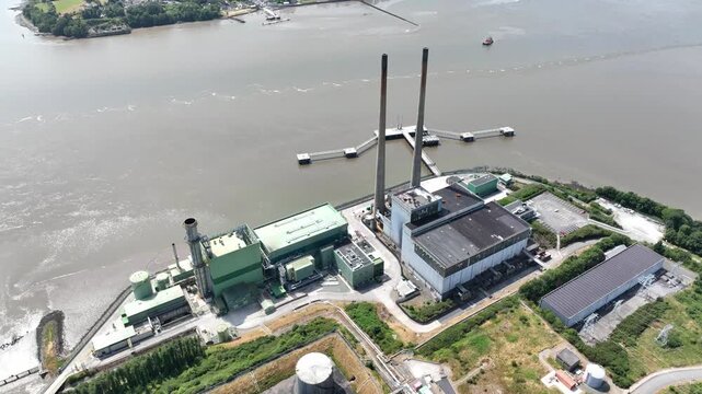Drone orbit high view perspective of electricity infrastructure on the River Suir, County Wexford.