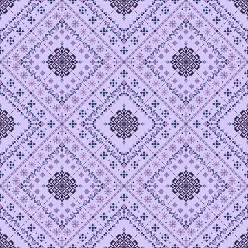Pixelated geometric floral design with layered diamond motifs, ornate rosettes, tiny blossoms and dotted accents in lavender, lilac, navy and pink.