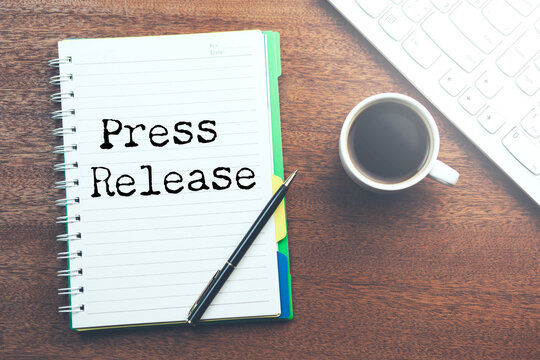 press release word under torn  paper