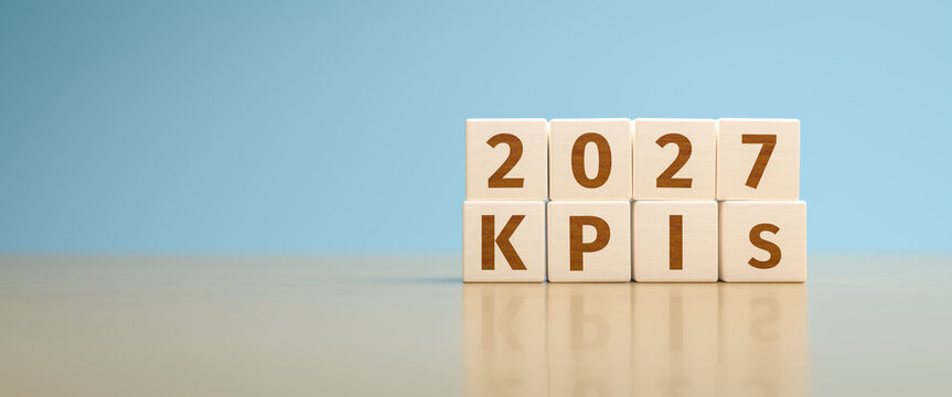 Wooden toy cubes forming the text "2027 KPIs". Concept for Key Performance Indicators of the year 2027 of an organisation or company.