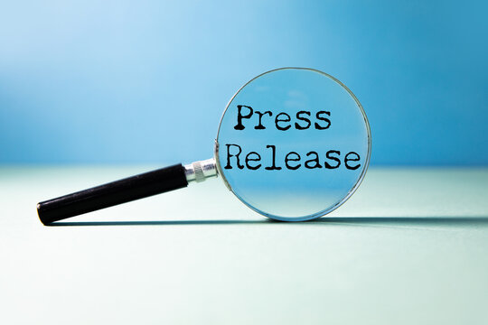 press release word under torn  paper