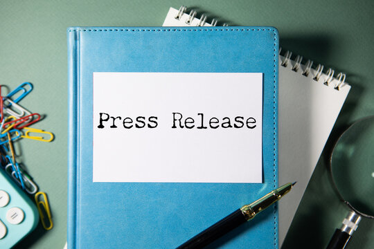 press release word under torn  paper