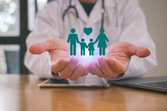 Medical health Insurance and wellness concept, Doctor holding family icon at hospital office. Medical health care and doctor staff service.