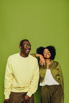 Youthful friends dance together in the studio with modern urban style