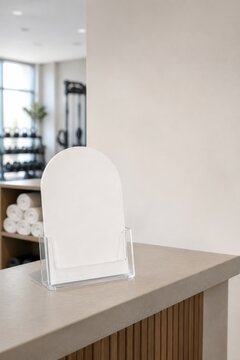 Blank arched sign on gym reception counter with blurred background