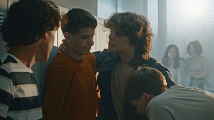 Obraz premium Bullies Pulling Smartphone Out of Helpless Student Pocket. While Pinning Against Lockers, Use Phone to Film Humiliated Reaction. Teenage Physical Theft, Digital Extortion, High School Intimidation.
