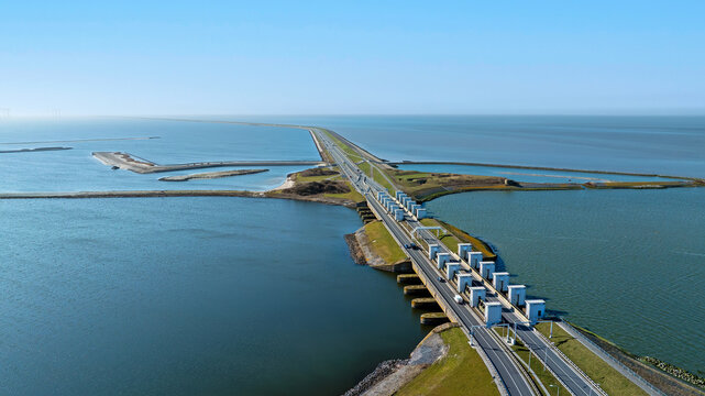 Coastal dam with highway and ecological waterway infrastructure in Europe