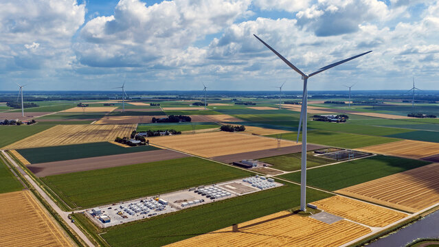 Aerial view of battery energy storage near a wind turbine in Friesland