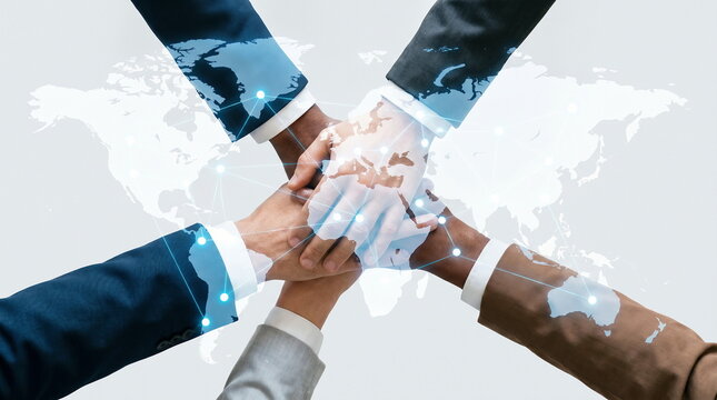 Global collaboration with business people stacking hands over world map network, international teamwork and digital connection concept.