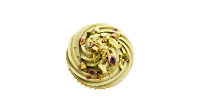 Delicious gourmet cupcake topped with smooth green pistachio cream frosting and crunchy nut pieces captured from a top down perspective isolated on a white on transparent background
