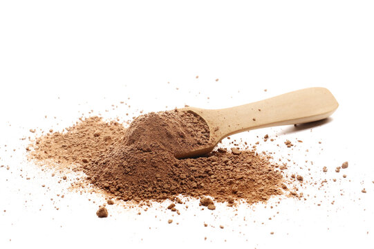 Chocolate ground, pile powder in wooden spoon isolated on white background, side view, clipping path