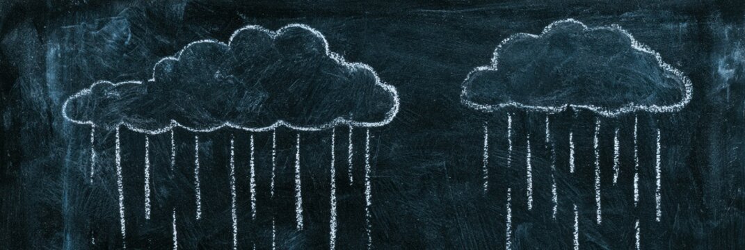 Chalk art shows two clouds with rain lines on a blackboard in a rustic location. It creates a creative atmosphere with simple design.
