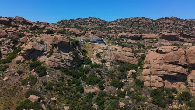 Modern House on Rocky Hillside, Aerial Drone Flyover, Simi Hills California