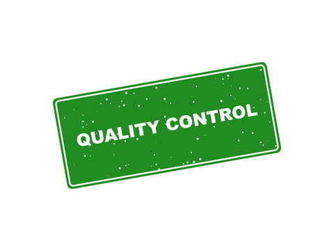 Green quality control rubber stamp isolated on a black background