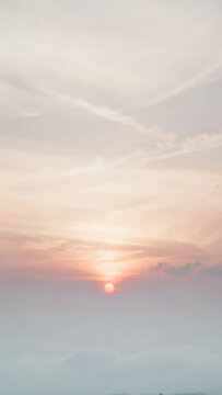 Dreamy Vertical Sky Background Featuring Soft Sunset Clouds And Warm Golden Horizon