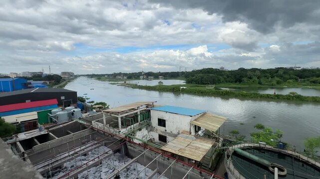 Aerial View of Industrial Wastewater Treatment Facility Beside River