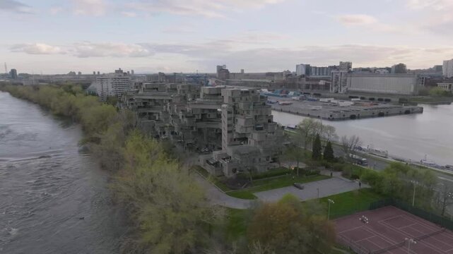 drone doing a circular motion exposing the strange building of habitat 67 in montreal quebec canada also the main road