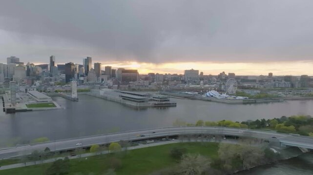 drone side move exposing the city of montreal starting from the circle du soleil old port main buildings n skyline n also the strange building of habitat 67