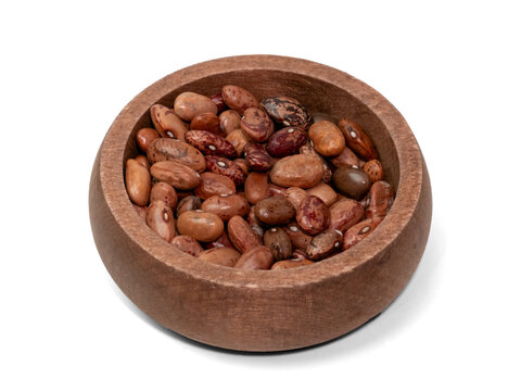 Mixed dried beans in wooden bowl isolated on transparent background, top view cutout