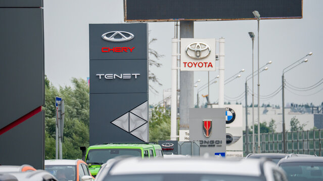Moscow August 29, 2026. Signboard of car dealerships chery TNT Chinese manufacturers and next to it a signboard of a Toyota dealership, a Japanese car manufacturer and a sign in the background of a