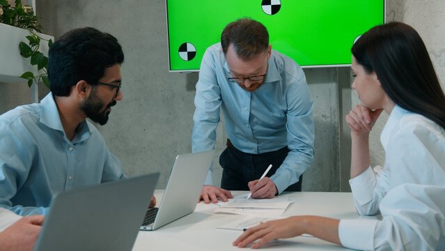 Multiracial business team signing contract agreement office meeting corporate discussion businessmen businesswoman colleagues leader working document interactive board green screen chroma key teamwork