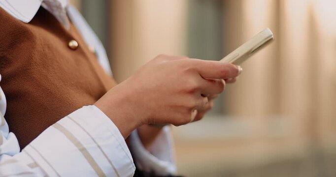 Phone, typing and hands of businesswoman in city with texting, communication or update on legal case. Technology, connectivity and attorney with cellphone for email review on law project in town.