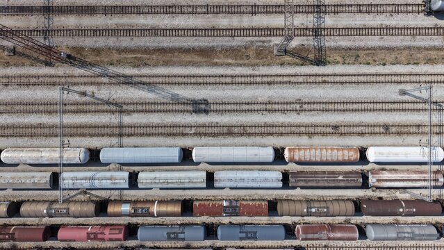 Aerial view of freight train cars parked on multiple parallel railway tracks in the industrial area of Severna zona in Pancevo, Serbia.