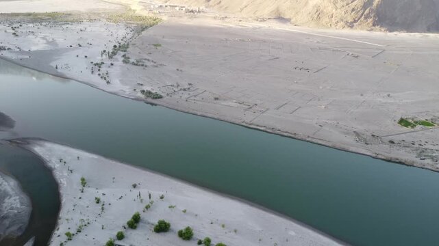 Indus River flows between the Karakoram and Himalayas at Skardu, Pakistan