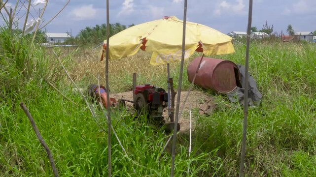 Water pump motor under yellow umbrella