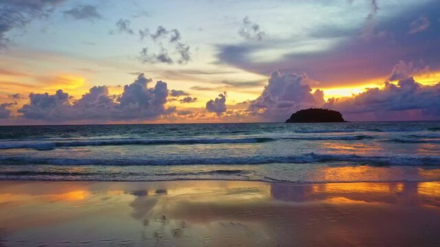 Aerial view of Twilight Serenity at Kata beach Phuket. Soft hues of orange, pink, and violet spread across the evening sky, merging with the calm sea in a breathtaking panorama of tropical beauty.