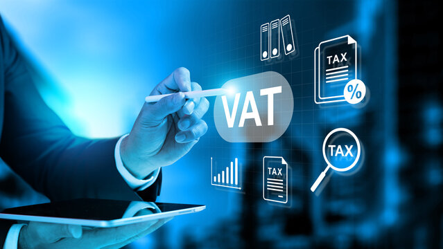 Businessman using a tablet and stylus to manage Value Added Tax (VAT) with virtual tax icons on a digital interface. Concept of house and property tax