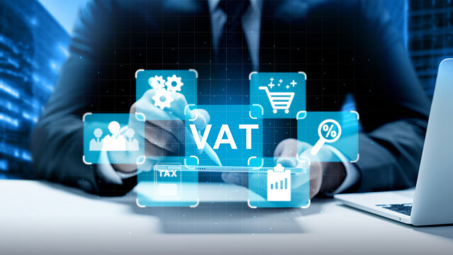 Businessman using digital tablet to manage Value Added Tax (VAT) with virtual financial and business icons. Concept of house and property tax