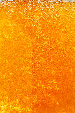 Macro Close Up of Golden Beer Bubbles Background