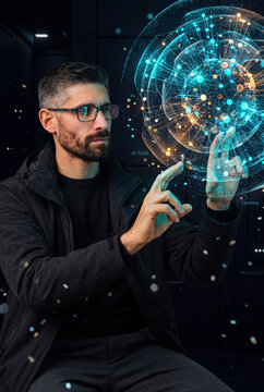 Close-up of a man shaping a glowing AI core hologram with both hands