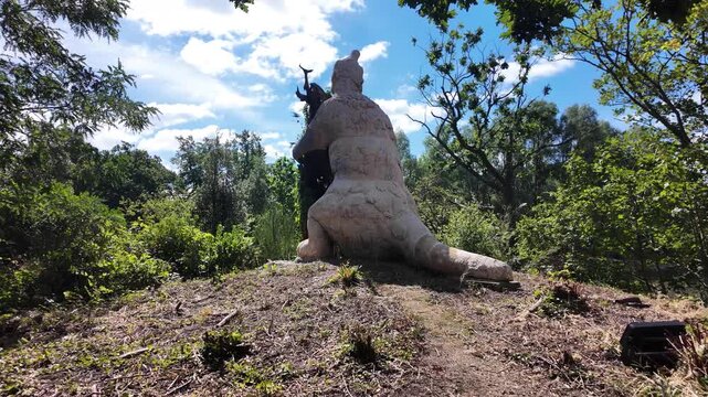 Exploring the impressive Megatherium sculpture, a prehistoric giant, at the historic Crystal Palace Dinosaurs exhibition.
