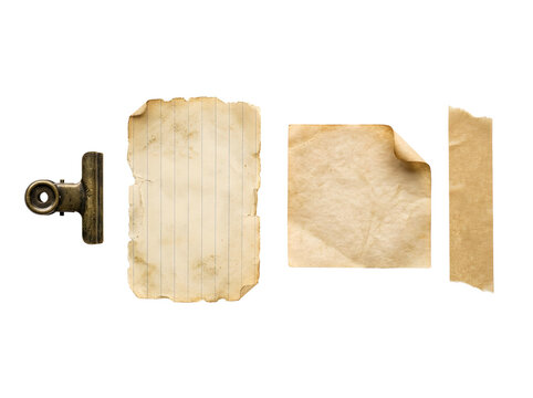 Antique brass clip with aged paper scraps and adhesive tape.