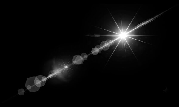 Radiant starburst lens flare effect captured with sharp white light rays and geometric hexagonal bokeh elements set against a deep black background for creative digital compositions