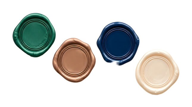 Four round wax seals in assorted metallic colors for letters.