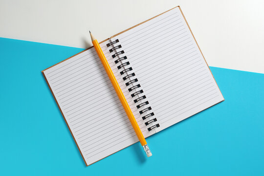Open Notebook with Pencil